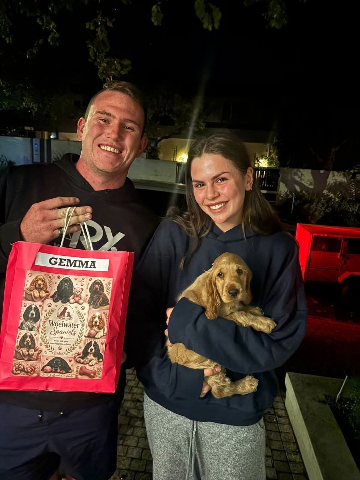 A couple collecting Gemma after dark