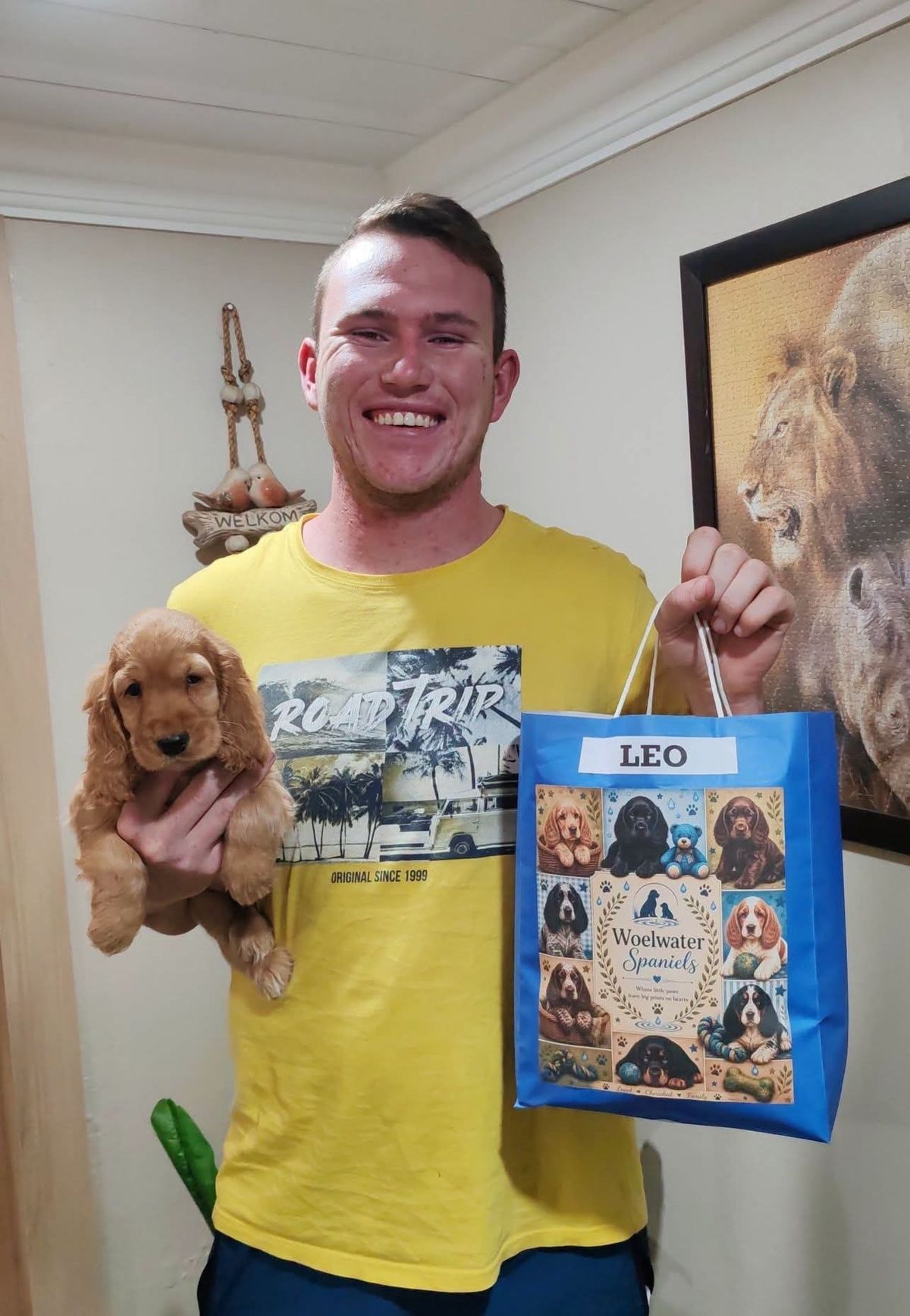 Leo handed over to his new owner with the breeder's bag