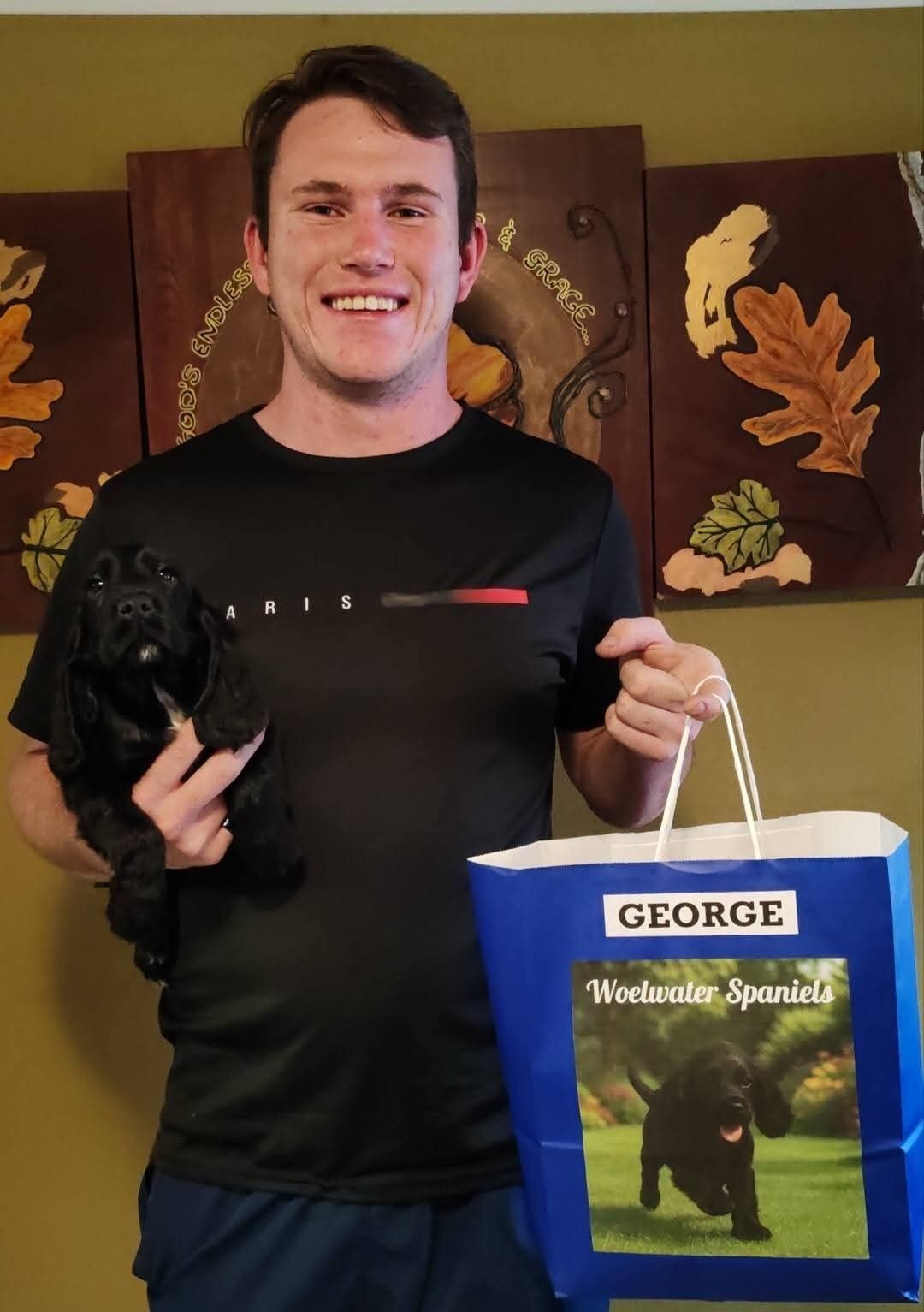 George handed over to his new owner with the breeder's bag